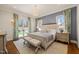 Bright bedroom with king-size bed and access to backyard at 291 Riverstone Dr, Pittsboro, NC 27312