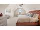 Spacious bedroom with plush bedding and a built-in sofa at 291 Riverstone Dr, Pittsboro, NC 27312