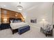 Serene bedroom with wood feature wall and plush bedding at 291 Riverstone Dr, Pittsboro, NC 27312