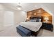 Spacious bedroom with wood accent wall and comfortable seating at 291 Riverstone Dr, Pittsboro, NC 27312