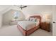 Bright bedroom with a comfortable bed and ample natural light at 291 Riverstone Dr, Pittsboro, NC 27312