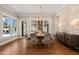 Bright dining room with an oval table and access to backyard at 291 Riverstone Dr, Pittsboro, NC 27312