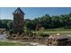 Landscaped detail of the community entrance with stonework and water feature at 291 Riverstone Dr, Pittsboro, NC 27312