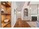 Elegant hallway with built-in shelving and hardwood floors at 291 Riverstone Dr, Pittsboro, NC 27312