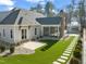 Luxury home with a large backyard, pool, and outdoor kitchen at 291 Riverstone Dr, Pittsboro, NC 27312