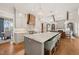 Open concept kitchen with large island and breakfast bar at 291 Riverstone Dr, Pittsboro, NC 27312