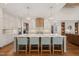 Modern kitchen with large island and granite countertops at 291 Riverstone Dr, Pittsboro, NC 27312