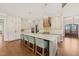 Large kitchen island with granite countertop and stainless steel appliances at 291 Riverstone Dr, Pittsboro, NC 27312