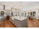 Island kitchen with white cabinets and granite countertops at 291 Riverstone Dr, Pittsboro, NC 27312