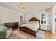 Main bedroom with large bed, dresser and sitting chair at 291 Riverstone Dr, Pittsboro, NC 27312