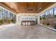Covered outdoor kitchen with stainless steel appliances at 291 Riverstone Dr, Pittsboro, NC 27312