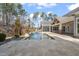 Inviting pool with spacious patio and tranquil landscaping at 291 Riverstone Dr, Pittsboro, NC 27312
