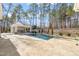 Relaxing pool area with outdoor kitchen and pergola at 291 Riverstone Dr, Pittsboro, NC 27312