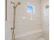 Spa-like shower with marble tile and built-in seat at 291 Riverstone Dr, Pittsboro, NC 27312