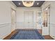 Study with hardwood floors, built-in shelving, and French doors at 291 Riverstone Dr, Pittsboro, NC 27312