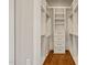 Spacious walk-in closet with built-in shelves and drawers at 291 Riverstone Dr, Pittsboro, NC 27312