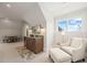 Bonus room with a wet bar, seating area and a window at 291 Riverstone Dr, Pittsboro, NC 27312