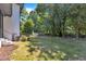 Lush backyard featuring mature trees and a well-manicured lawn at 2601 Mayview Rd, Raleigh, NC 27607