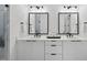 Modern bathroom with double vanity, black matte fixtures, and marble countertops at 2601 Mayview Rd, Raleigh, NC 27607