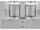 Elegant bathroom showcasing a double vanity with sleek fixtures and framed mirrors at 2601 Mayview Rd, Raleigh, NC 27607