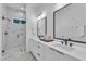 This bathroom has a double vanity with a glass-enclosed marble shower at 2601 Mayview Rd, Raleigh, NC 27607