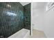 Bathroom with dark green tiled shower and bathtub at 2601 Mayview Rd, Raleigh, NC 27607