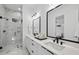 Spa-like bathroom with marble shower, double vanity, and modern fixtures at 2601 Mayview Rd, Raleigh, NC 27607