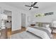 Well-lit bedroom features a ceiling fan, carpet, and walk-in closet at 2601 Mayview Rd, Raleigh, NC 27607