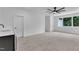 This bedroom features a ceiling fan, carpet, and a wet bar at 2601 Mayview Rd, Raleigh, NC 27607