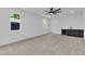This bedroom features a ceiling fan and a wet bar with a wine cooler at 2601 Mayview Rd, Raleigh, NC 27607