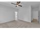 Spacious bedroom with carpet floors, ceiling fan, and access to a bathroom with vanity at 2601 Mayview Rd, Raleigh, NC 27607