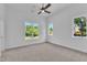 Empty bedroom with carpet and large windows at 2601 Mayview Rd, Raleigh, NC 27607