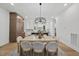 Bright dining room with large chandelier and light wood table at 2601 Mayview Rd, Raleigh, NC 27607