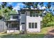 Modern two-story home with black trimmed windows and a screened porch at 2601 Mayview Rd, Raleigh, NC 27607