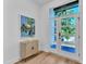 Bright foyer showcasing a stylish console table, eye-catching artwork, and a door featuring five glass panels at 2601 Mayview Rd, Raleigh, NC 27607