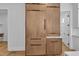 Kitchen featuring built-in wooden cabinets and drawers, complemented by white walls and sleek hardware at 2601 Mayview Rd, Raleigh, NC 27607