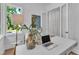 Office nook features a table, laptop, and outdoor view at 2601 Mayview Rd, Raleigh, NC 27607