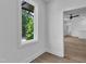 Bright room features hardwood floors and a large window with green outdoor view at 2601 Mayview Rd, Raleigh, NC 27607
