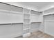 Walk-in closet with built-in shelving and hanging rods for organization at 2601 Mayview Rd, Raleigh, NC 27607