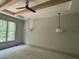 Bright bedroom showcasing wood beam ceilings, large windows, and stylish pendant lighting fixtures at 57 Hazelwood, Pittsboro, NC 27312