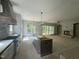 Spacious open floor plan with built-in shelves, fireplace, and large windows overlooking a private backyard at 57 Hazelwood, Pittsboro, NC 27312