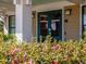 View of the Clubhouse exterior featuring beautiful flowers, doors labeled with 'Chapel Ridge' and outdoor lighting at 72 Hazelwood, Pittsboro, NC 27312