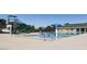 Outdoor community pool with slide, splash umbrella, and plenty of space for lounging at 72 Hazelwood, Pittsboro, NC 27312