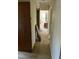 Long hallway with carpeted floor and doors leading to other rooms at 3418 Leonard St, Raleigh, NC 27607