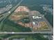 Aerial view of Medley apartments, Lowe's Foods, and future commercial real estate development sites at 167 Edgefield St, Pittsboro, NC 27312