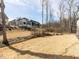 A flat backyard is ready for its new owner's touches at 167 Edgefield St, Pittsboro, NC 27312