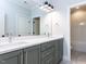 Modern bathroom featuring a double vanity with gray cabinets and stylish hardware at 167 Edgefield St, Pittsboro, NC 27312