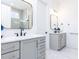 Bright bathroom featuring double vanity with gold fixtures and marble floors at 167 Edgefield St, Pittsboro, NC 27312