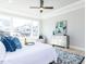 Bright bedroom featuring a large window, trey ceiling, and modern ceiling fan at 167 Edgefield St, Pittsboro, NC 27312