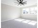 Bedroom with large windows and carpet floors at 167 Edgefield St, Pittsboro, NC 27312